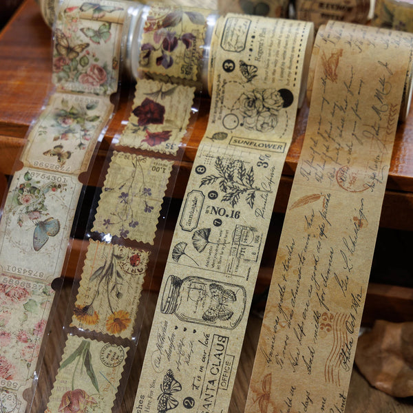 A set of vintage washi die-cut decorative paper tape rolls featuring floral and botanical designs.