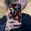 A hand holds an iPhone case featuring a collage of Michael Myers horror imagery against a dark background.