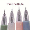 A set of retractable craft knives in various pastel colors, including green, pink, and blue.