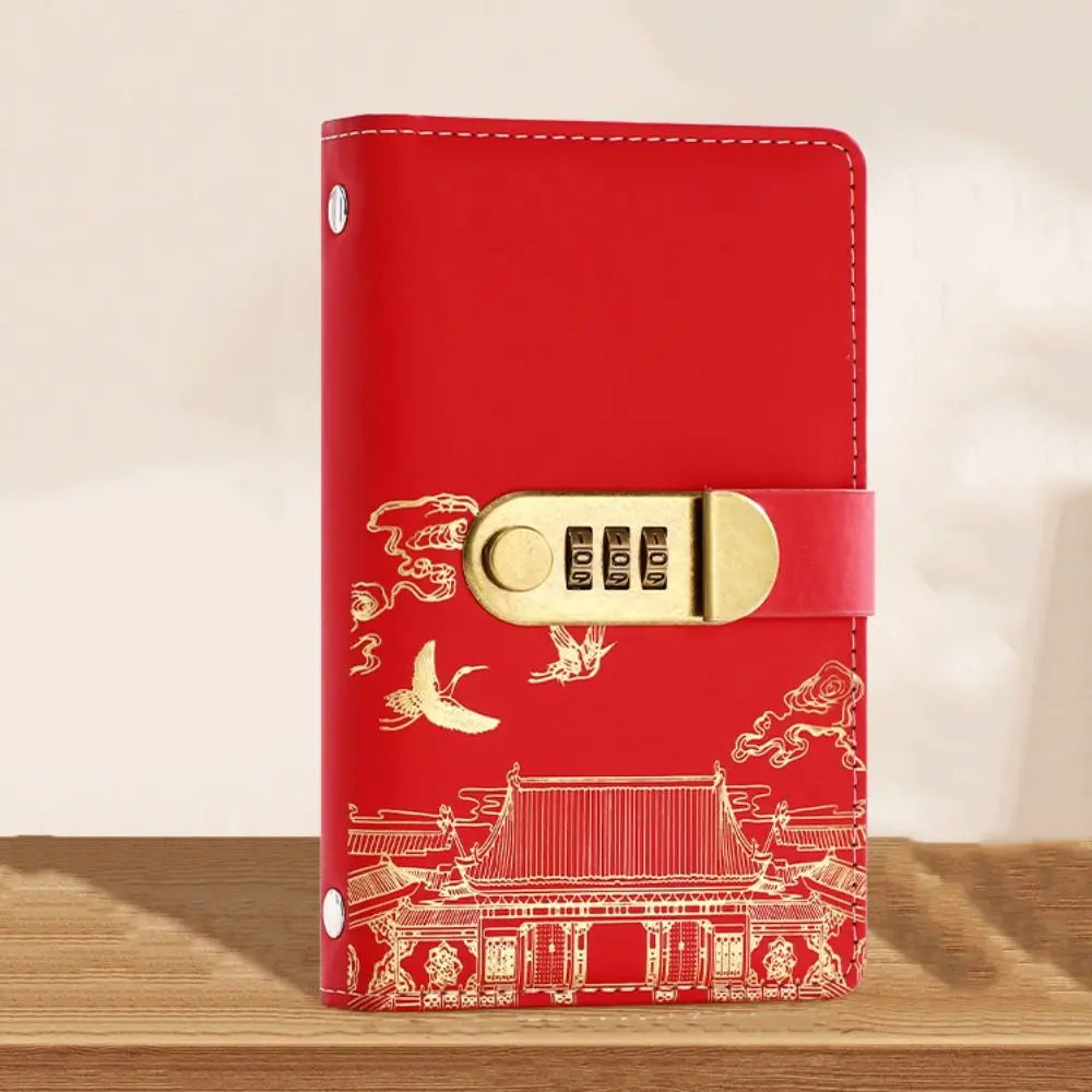 A red personal finance budget binder with a gold lock and intricate traditional Chinese patterns on the cover.