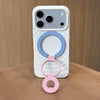 A white phone case with a magnetic ring grip featuring light blue and pink rings.