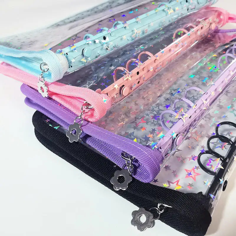 A stack of transparent zipper photo binders in various pastel colors including blue, pink, purple, and black.
