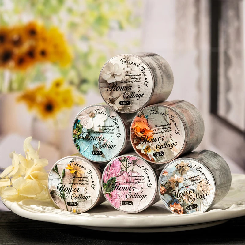 A collection of decorative floral themed washi tape rolls in various shades of gold and green on a white plate.