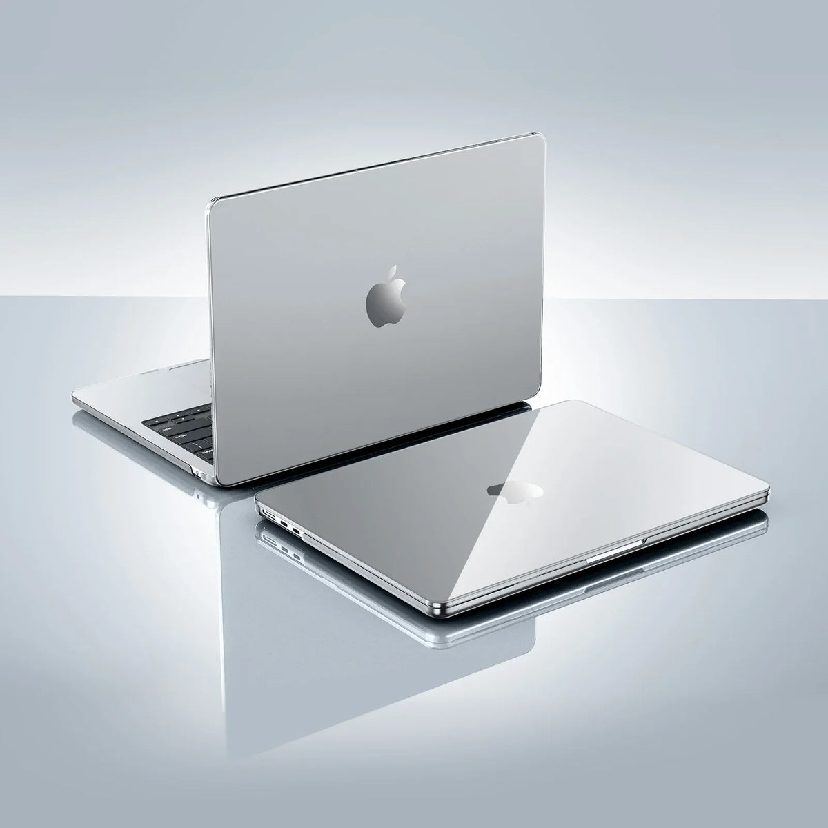 A silver Apple MacBook Pro laptop is shown with an ultra-slim hard shell case on a light gray surface.