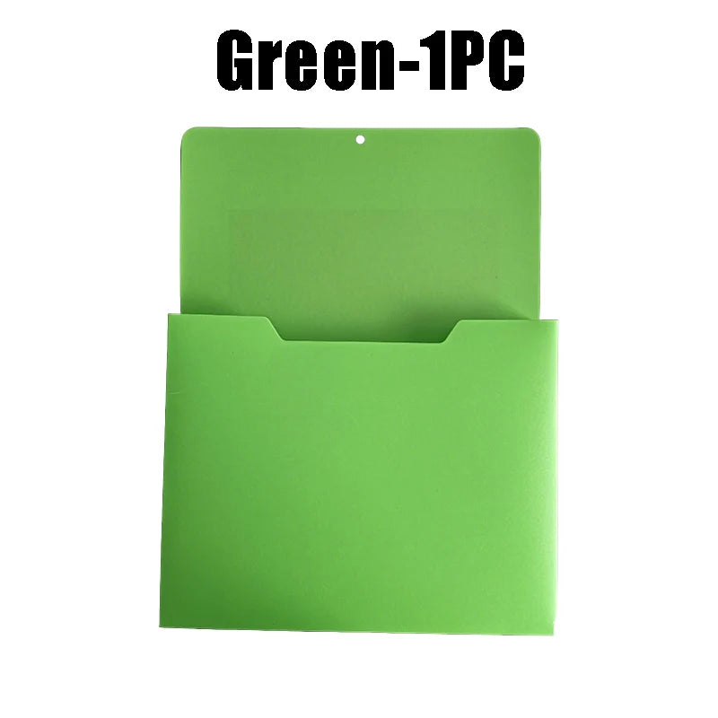 A green wall mount magnetic document file holder with a hinged cover.