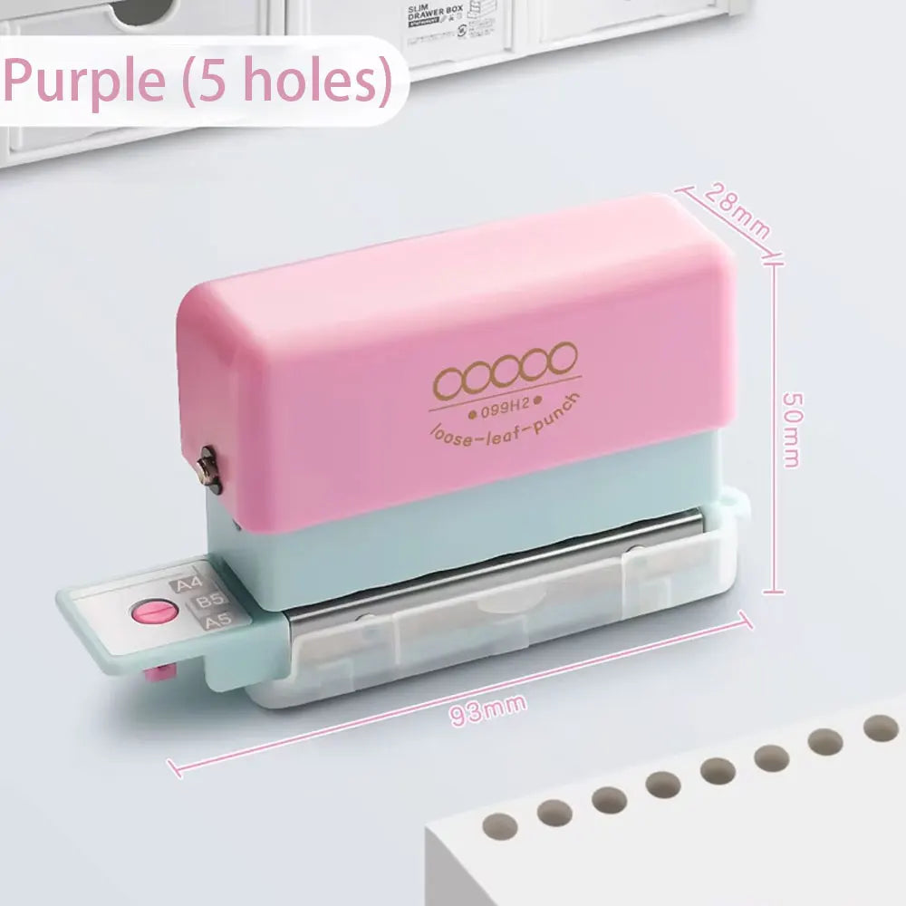 A pink mini multi-hole punch with a blue body and silver metal punch, shown next to a stack of paper.