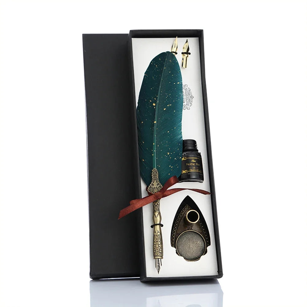 A black gift box contains a feather, a dip pen, and a dagger set for retro calligraphy.