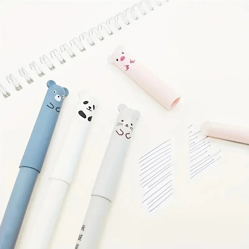 A set of pink and blue panda-themed erasable gel pens with refills placed on a white background next to a spiral notebook.