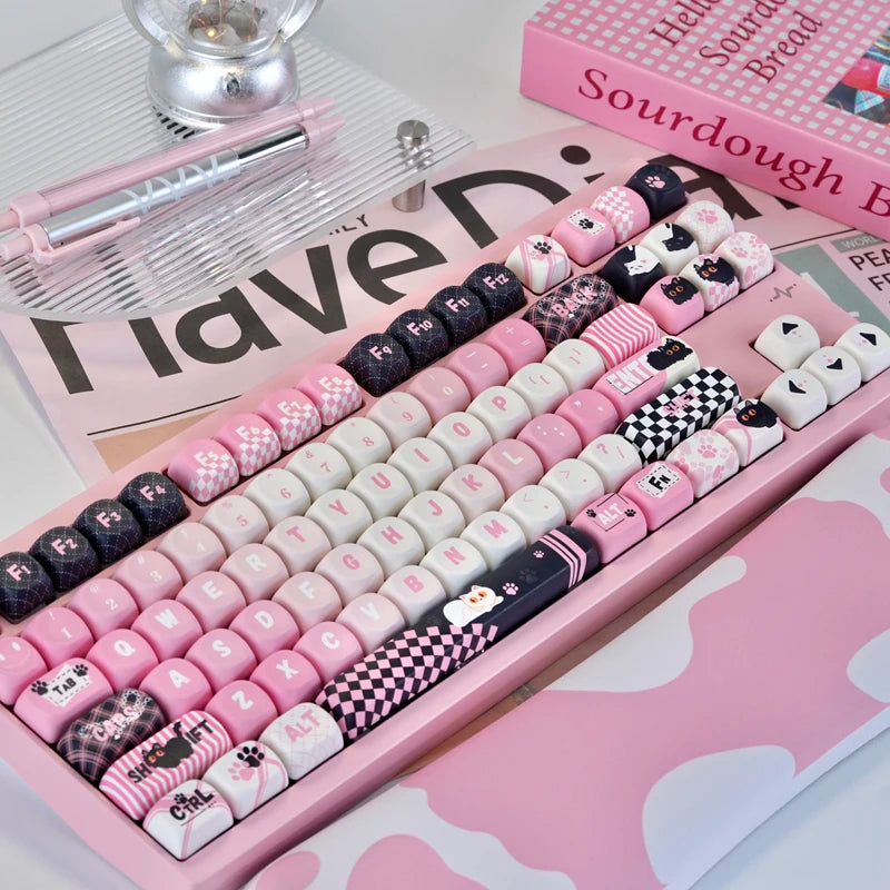 A pink and black PBT keycap set featuring various characters and designs for mechanical keyboards.