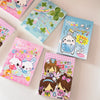 A collection of colorful decorative memo pads featuring cute characters and designs in retro Showa style.