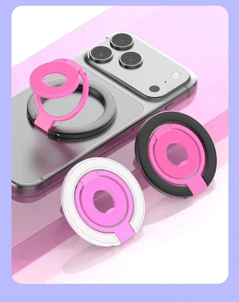 A pink magnetic ring grip with a foldable kickstand shown on a gray smartphone.