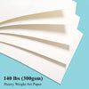A stack of white watercolor paper sheets angled diagonally against a light blue background.