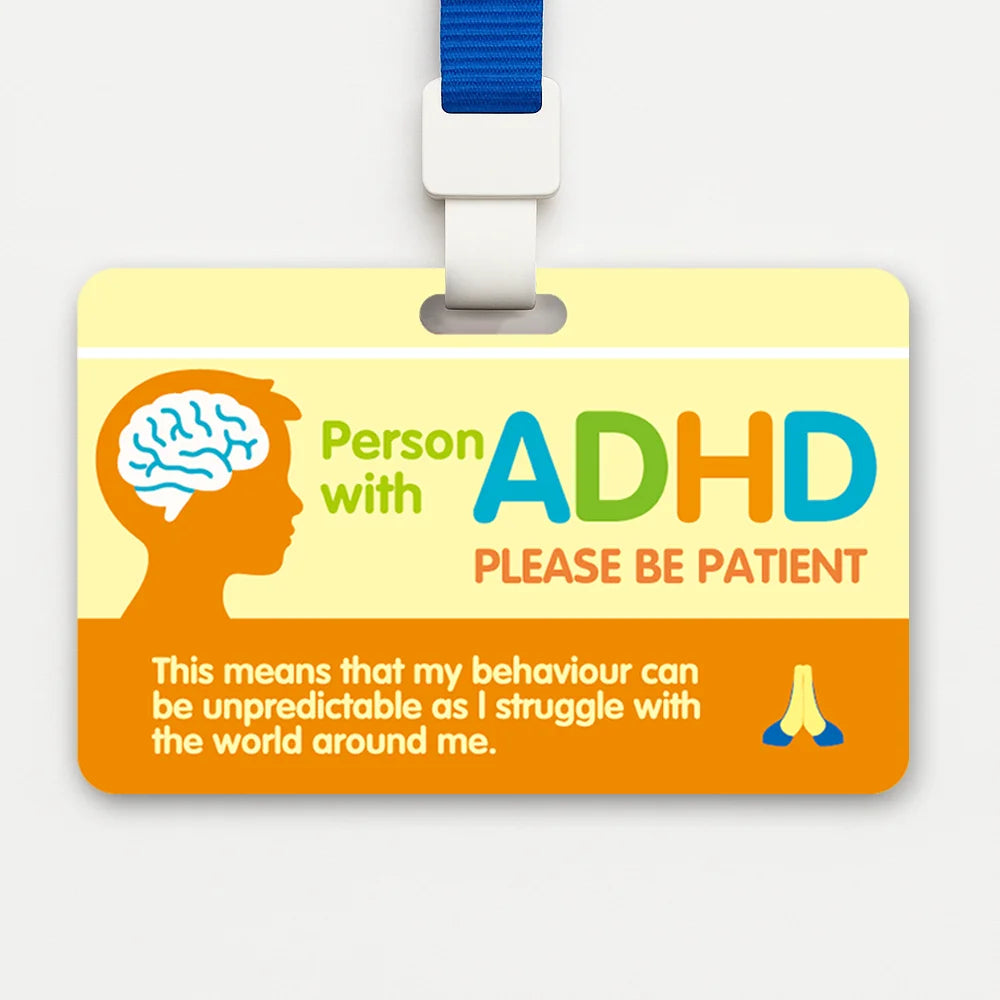 A yellow card with text about ADHD awareness and a brain silhouette, attached to a blue lanyard.