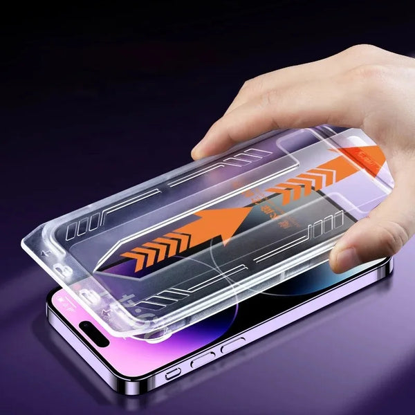 A hand holds a smartphone with an HD tempered glass screen protector applied, showing a purple and orange design.