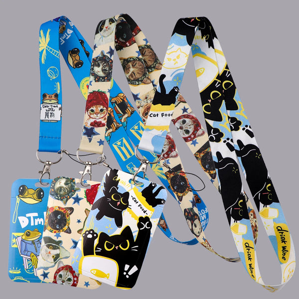 A collection of colorful cat-themed lanyards and card holders featuring various cats and cute designs.