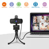 A black HD webcam mounted on a flexible stand connected via a cable, positioned in front of an open laptop.