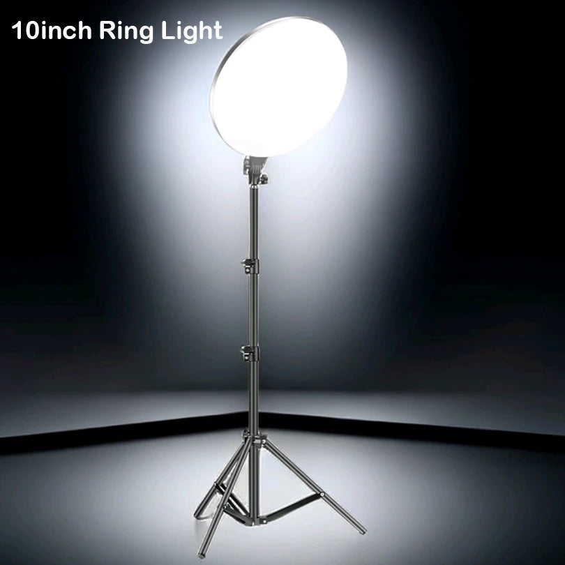 A 10-inch LED ring light mounted on a tripod stand with a boom arm, illuminating a dark background.