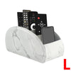 A white marble PU leather remote control holder with five compartments displaying various electronic devices.
