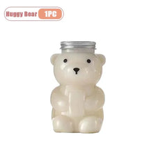 A cute, white bear-shaped reusable water bottle with a silver lid.