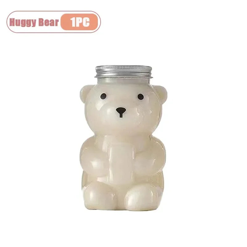 A cute, white bear-shaped reusable water bottle with a silver lid.