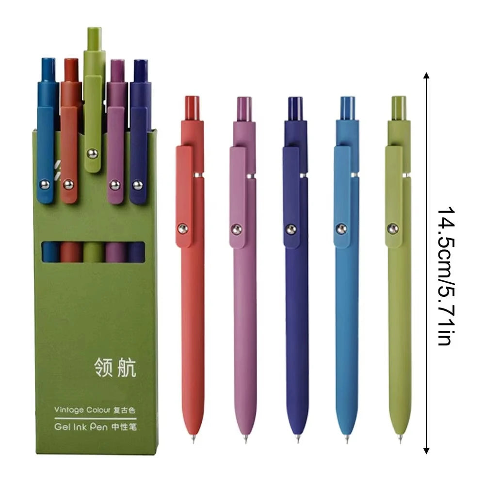 A set of five colorful gel ink pens in various shades displayed against a green background.