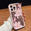 A pink leopard print phone case featuring a large pink lily floral design, held by a hand.