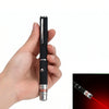 A hand holds an interactive pet training pen with a black and silver body, demonstrating its use.
