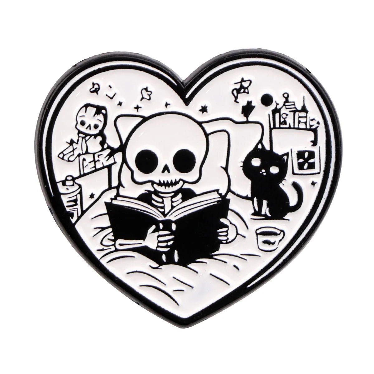 A black enamel lapel pin shaped like a heart featuring a skull, a cat, and an open book.