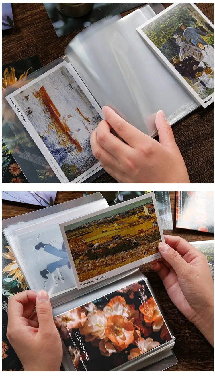 A hand holds an A6 photo storage booklet displaying a landscape painting.