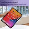 A hand holds an iPad Pro with a magnetic stylus pen attached to the side.