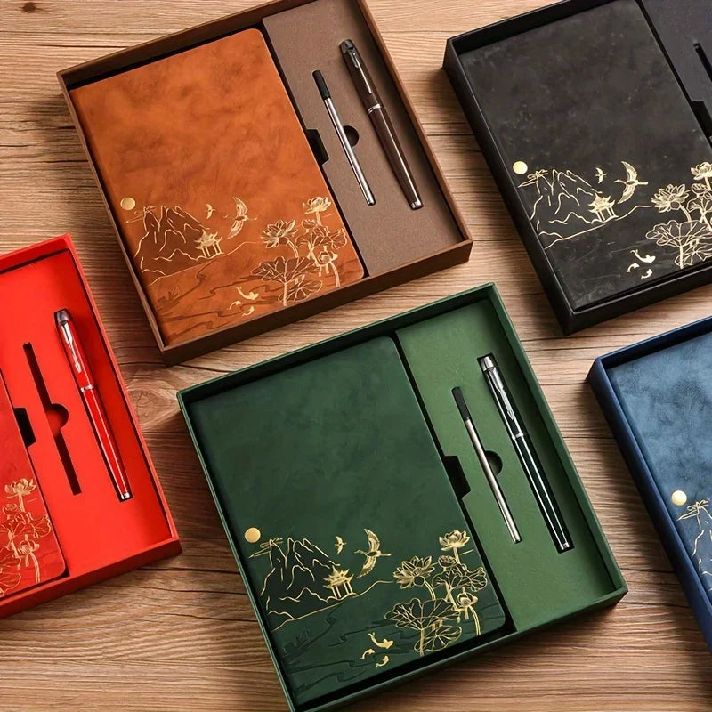 A set of luxury PU leather notebooks and pens in brown, black, and green housed in wooden boxes.