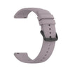 A purple silicone watch band for a smartwatch, shown in a curved shape.