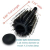 A black hair brush with a wide head and a hidden compartment, showing its dimensions.