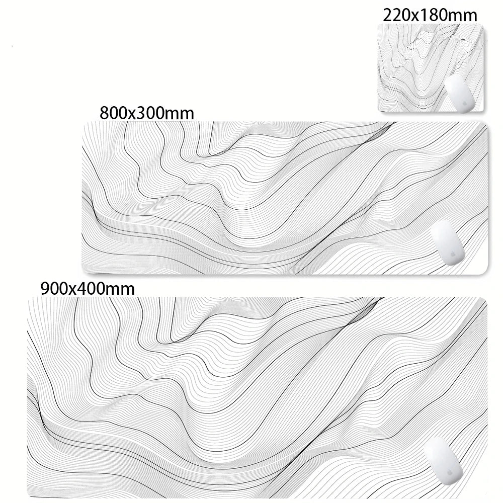 Abstract black and white wavy desk mat featuring subtle lines and a small white object.