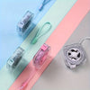 A set of compact, clear plastic retractable measuring tapes in pink and clear are displayed on a light surface.