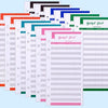 A stack of A6 budget planner binders with envelope pockets and expense sheets in various colors.