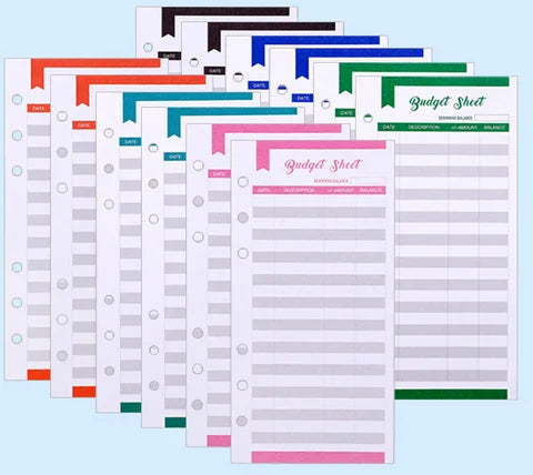 A stack of A6 budget planner binders with envelope pockets and expense sheets in various colors.