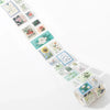 A strip of vintage stamp tape stickers featuring floral and nature designs in various pastel colors for scrapbooking.