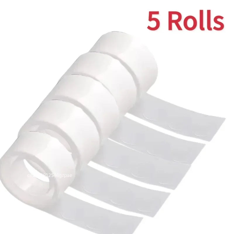 Five rolls of clear double-sided adhesive dots for crafts and DIY projects