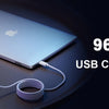 A white 96W MacBook USB C fast charger connected to a silver laptop.