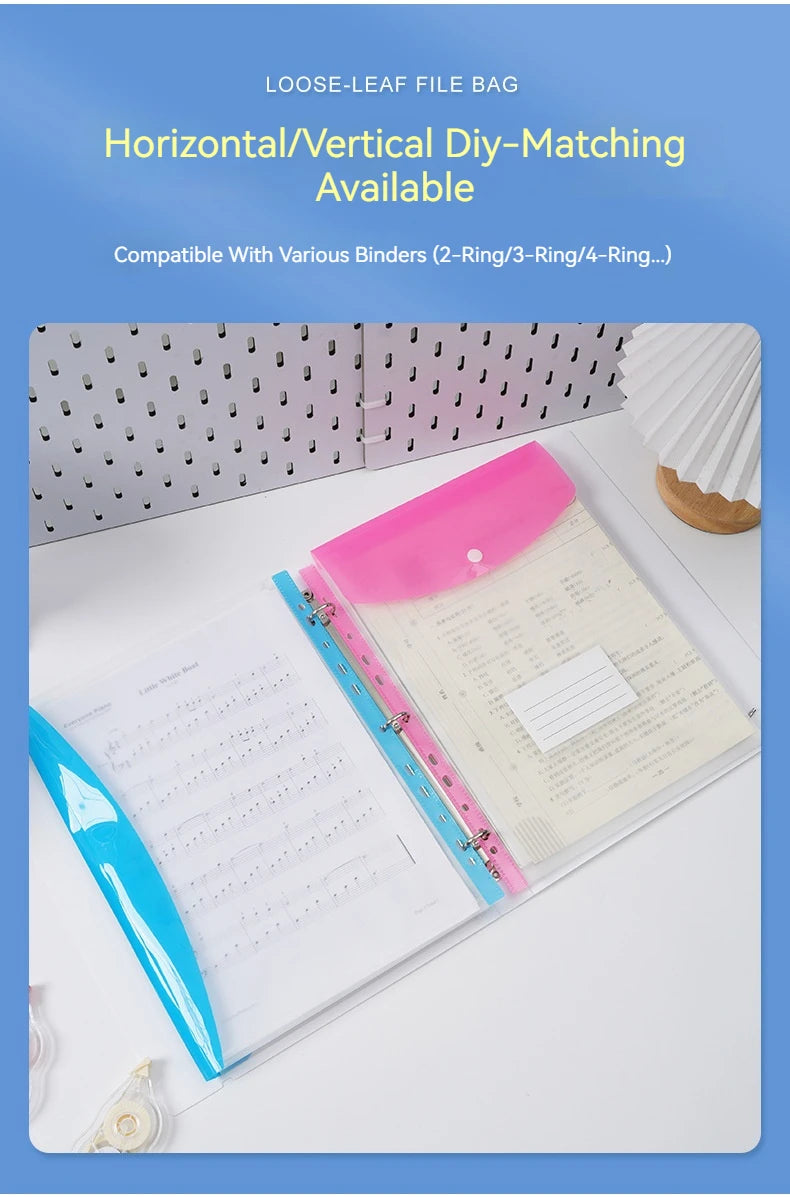 A close-up view of pink and blue plastic expanding file envelopes with snap buttons displayed on a white surface.