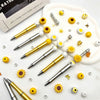 A set of gold and silver beaded pens with sunflower accents displayed on a white background.
