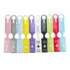 A row of colorful durable PVC luggage tags in various shades including pink, gray, blue, yellow, and green.