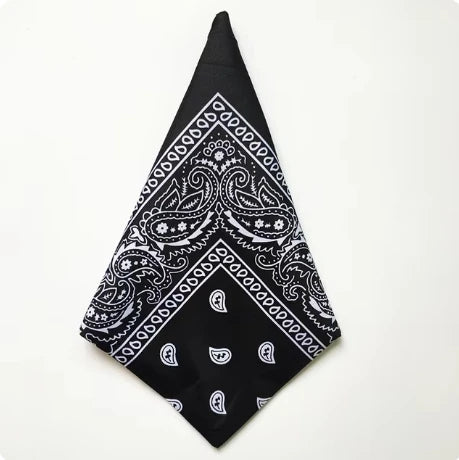 Black bandana square scarf with white paisley print featuring intricate floral and geometric patterns