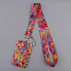 A colorful, heart-shaped lanyard with a vibrant pattern of various colored hearts and stripes.
