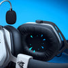 A white and black gaming headset is displayed against a blue background with a computer fan visible.