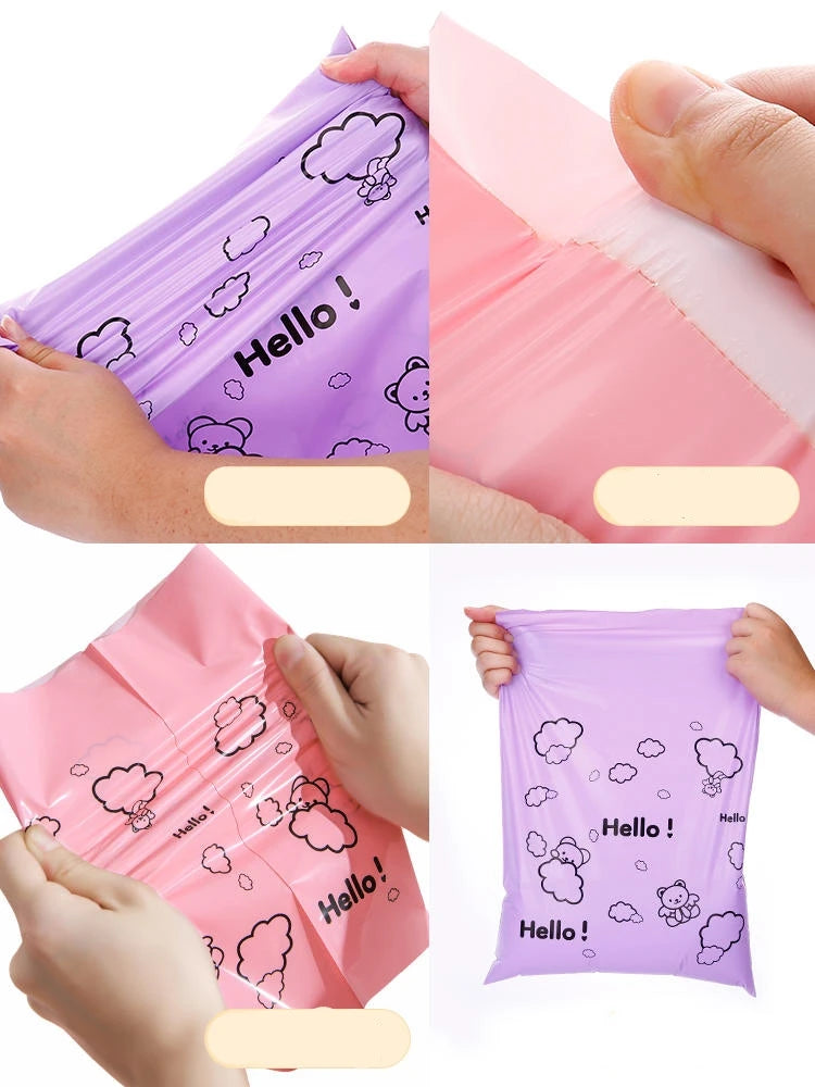 Hands hold a pink reusable plastic mailing bag with a cloud pattern, showing the clear plastic material.