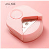 Two pink precision corner cutters for paper and cardstock shown from above