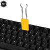 A yellow 2-in-1 stainless steel keycap and switch puller tool for mechanical keyboards