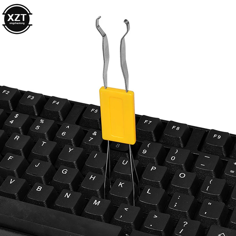 A yellow 2-in-1 stainless steel keycap and switch puller tool for mechanical keyboards